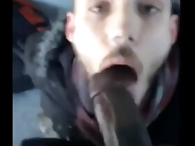 White guy sucking a big fat black cock outside