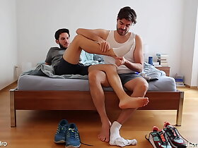 Gay friends playing with feet, socks and shoes