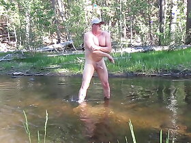 Naked bathing in the river.